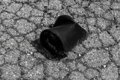 Abandoned Can On Cracked Asphalt